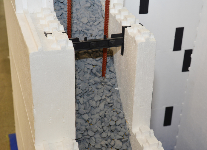 A close-up on insulating concrete forms ICF, cast-in-place concrete walls that are sandwiched between two layers of insulation polystyrene foam material for residential and industrial constructions.